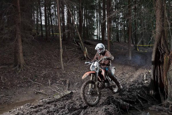 An image of a young boy on a motorcycle in the woods taking part in the Archway project, a motorcycle education and youth centre programme supported by the Ellis Campbell Foundation, helping disadvantaged young people in Hampshire, London and Perthshire
