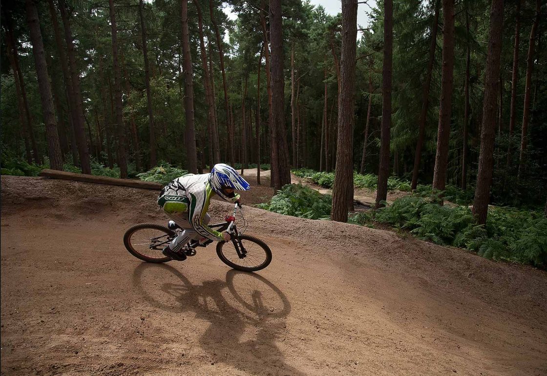 An image of a young boy on a motorcycle in the woods taking part in the Archway project, a motorcycle education and youth centre programme supported by the Ellis Campbell Foundation, helping disadvantaged young people in Hampshire, London and Perthshire