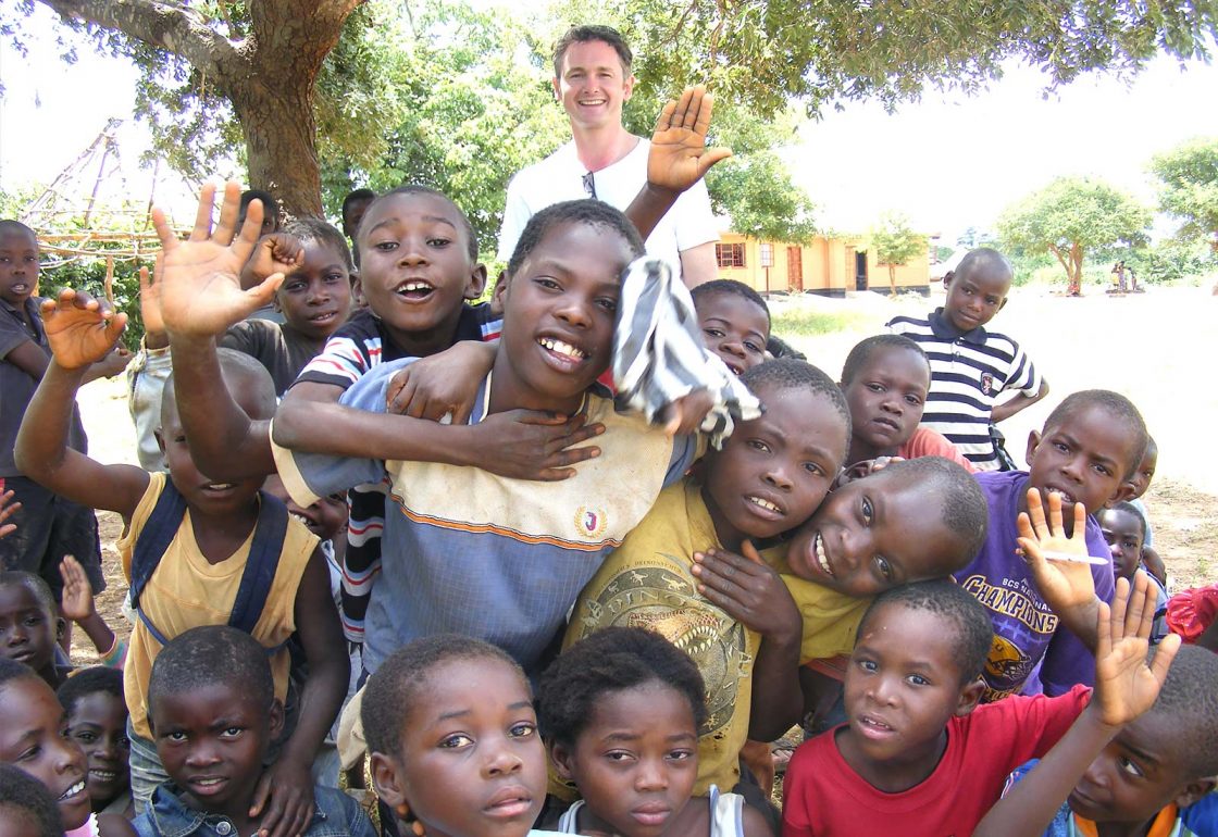 An image of Jamie Campbell and a group of young people at Makangwe Community School, a build It International project supported by the Ellis Campbell Foundation, helping disadvantaged young people in Hampshire, London and Perthshire