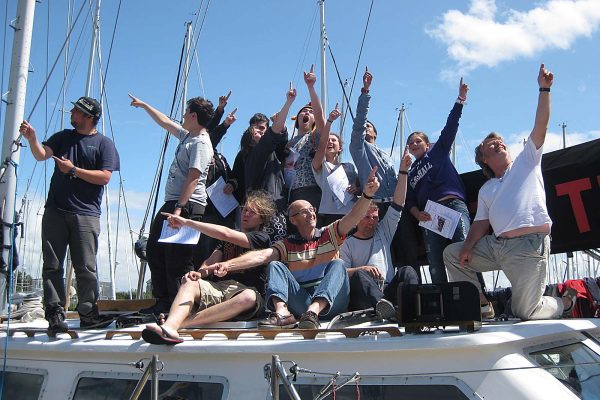 An image of a group of young people sat on the roof of a boat part of Ocean Youth Trust South a charity supported by the Ellis Campbell Foundation, helping disadvantaged young people in Hampshire, London and Perthshire