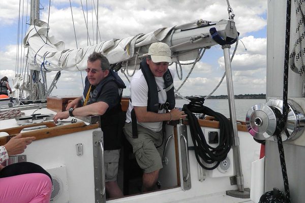 An image of crew members aboard a sailing boat, part of Ocean Youth Trust South, a charity supported by the Ellis Campbell Foundation, helping disadvantaged young people in Hampshire, London and Perthshire