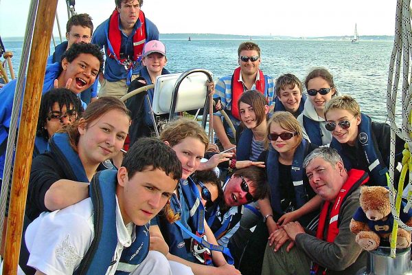 An image of a group of young people aboard a sailing boat in the Solent part of Ocean Youth Trust South, a charity supported by the Ellis Campbell Foundation, helping disadvantaged young people in Hampshire, London and Perthshire
