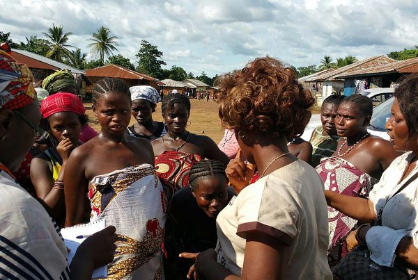 An image of African women in a rural community in Sierra Leone partaking in a sensitisation campaign, a cause supported by the Ellis Campbell Foundation, helping disadvantaged young people in Hampshire, London and Perthshire