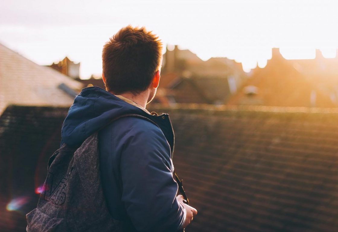 A colour photo of a young man overlooking rooftops representing the Spark Inside coaching programme, a charity supported by the Ellis Campbell Foundation, helping disadvantaged young people in Hampshire, London and Perthshire