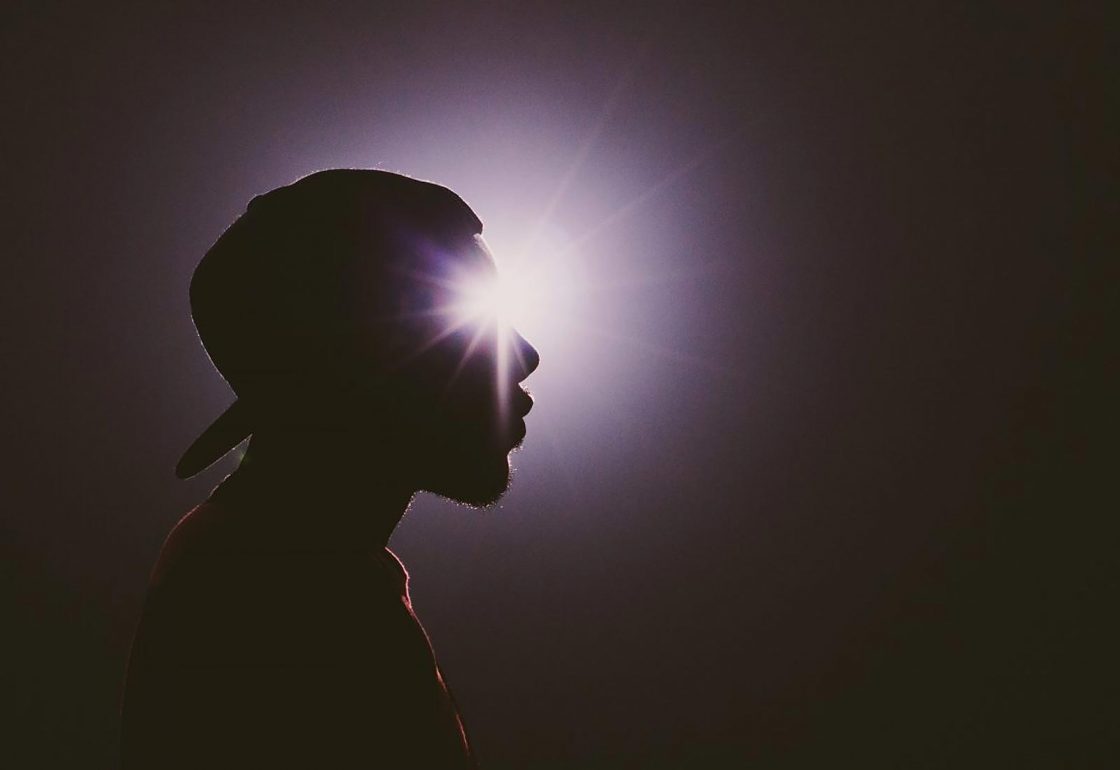 An image of a young man blacked out with light shining through, representing the Spark Inside coaching programme, a charity supported by the Ellis Campbell Foundation, helping disadvantaged young people in Hampshire, London and Perthshire