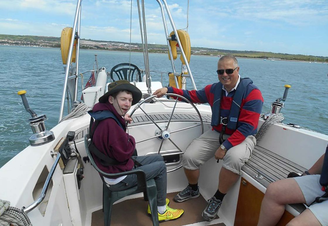 An image of Ben sailing a yacht the Treloar Trust Campbell Sports fund, a charity supported by the Ellis Campbell Foundation, helping disadvantaged young people in Hampshire, London and Perthshire