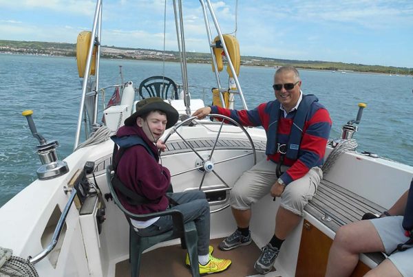 An image of Ben sailing a yacht the Treloar Trust Campbell Sports fund, a charity supported by the Ellis Campbell Foundation, helping disadvantaged young people in Hampshire, London and Perthshire