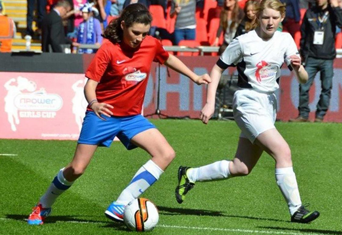 An image of two young female footballers representing Football in the Community an Ellis campbell Foundation grant helping disadvantaged young people in Hampshire, London and Perthshi