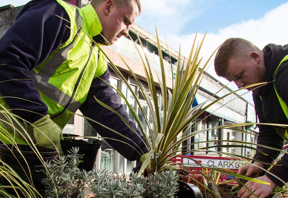 An image of two men helping with a gardening project representing Young Enterprise Scotland a grant by the Ellis Campbell Foundation helping disadvantaged young people in Hampshire, London and Perthshire