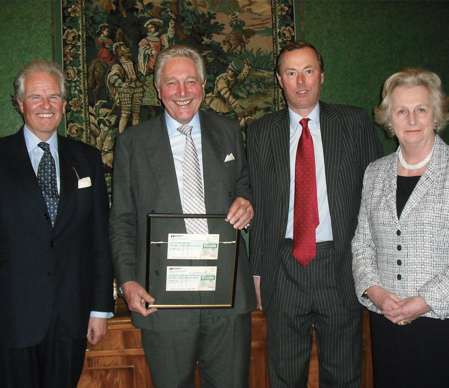 An image ofMichael Campbell receiving a thank you on his retirement from HIWCF