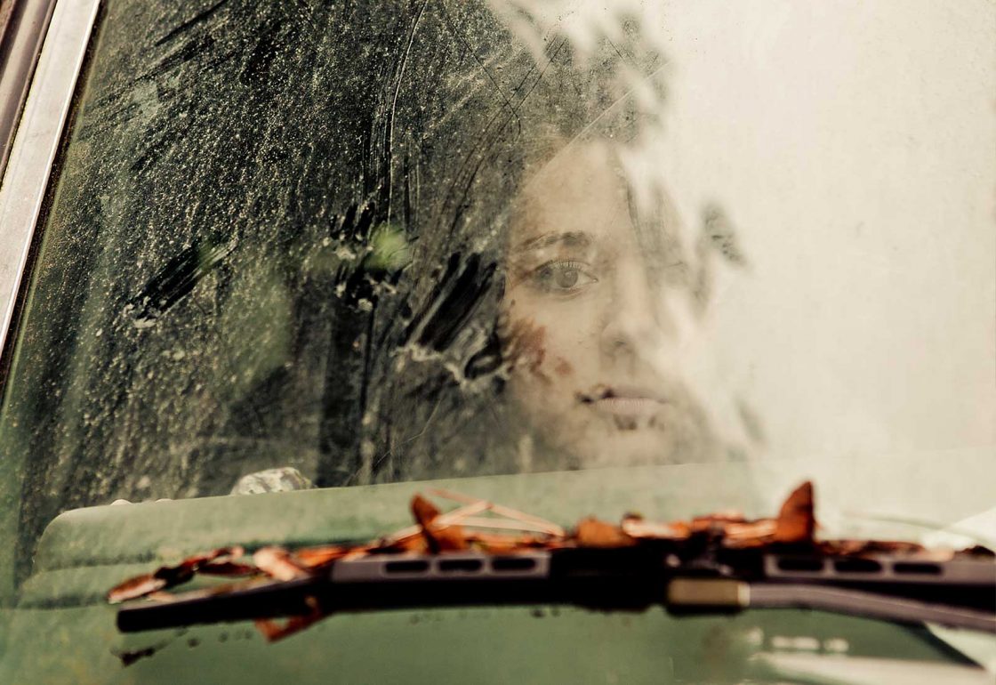 An image of a girl looking sad looking through a windscreen on a rainy day representing the MAC UK Mental Health Support Programme Grant made by the Ellis Campbell Foundation helping disadvantaged young people in Hampshire, London and Perthshire