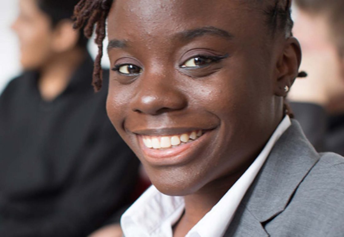 An image of a young black girl smiling representing the Resurgo Grant made by the Ellis Campbell Foundation helping disadvantaged young people in Hampshire, London and Perthshire