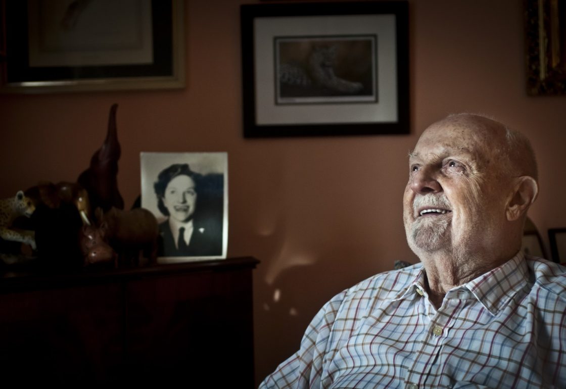 A colour image of a smiling lonely old man part of the Winter Warmth Campaign supported by the Kensington & Chelsea Foundation - The Ellis Campbell Foundation - A grant made by The Ellis Campbell Foundation