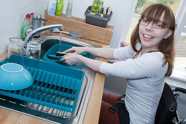 A colour image of a female student living independently as part of the Orpheus personalised study programme supported by The Ellis Campbell Foundation