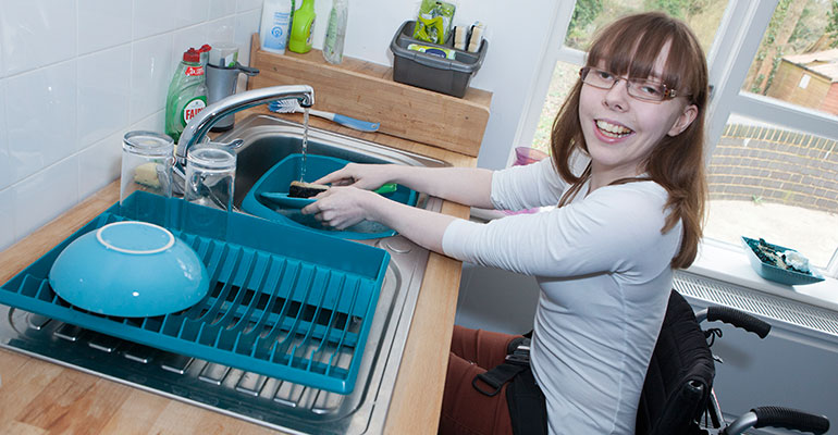 A colour image of a female student living independently as part of the Orpheus personalised study programme supported by The Ellis Campbell Foundation