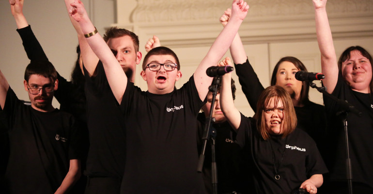 A colour image of students performing a theatrical show as part of the Orpheus personalised study programme supported by The Ellis Campbell Foundation