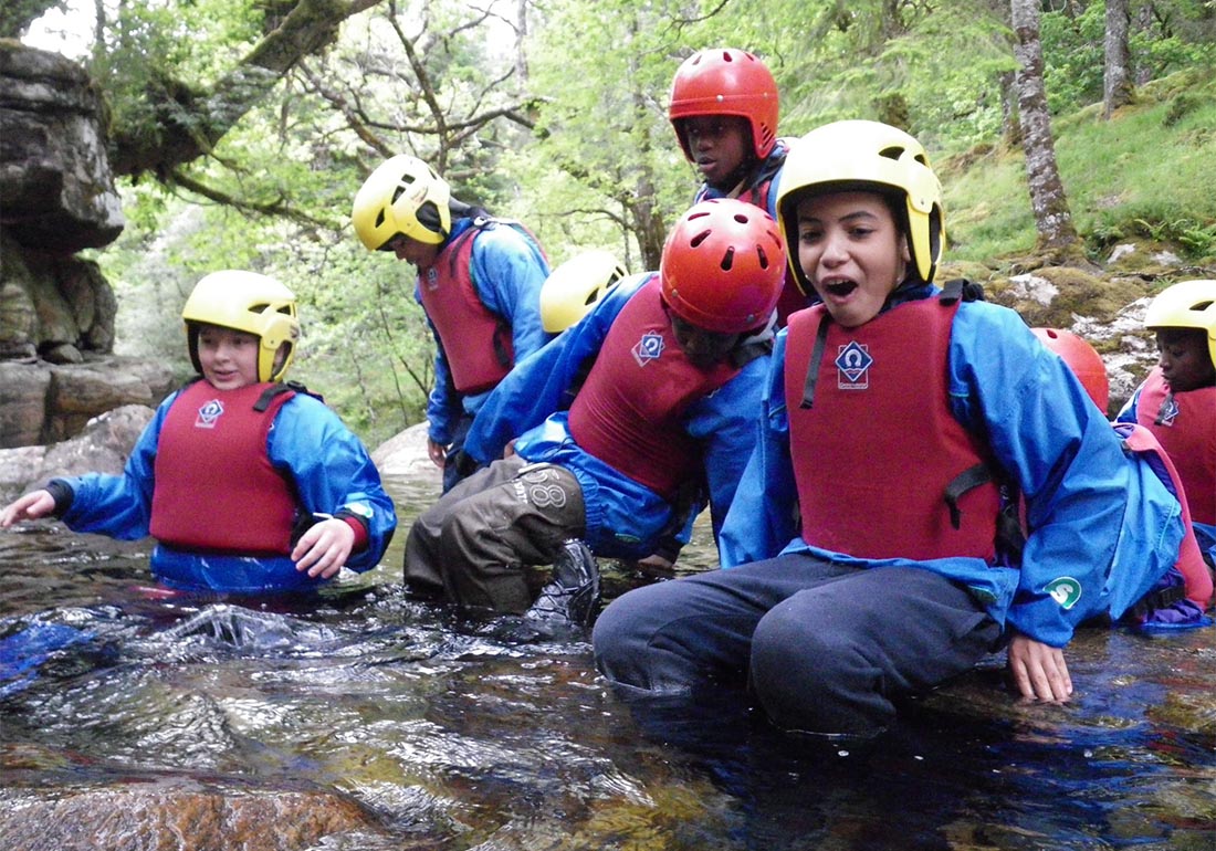 A colour image of a a group of students taking part in Outward Bound Snowdonia quay jumping - A charity supported by The Ellis Campbell Foundation