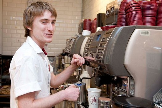 A colour image of Jay Tarrant working in Pret A Manger part of the St Mary le Bow Young Homeless Charity supported by The Ellis Campbell Foundation