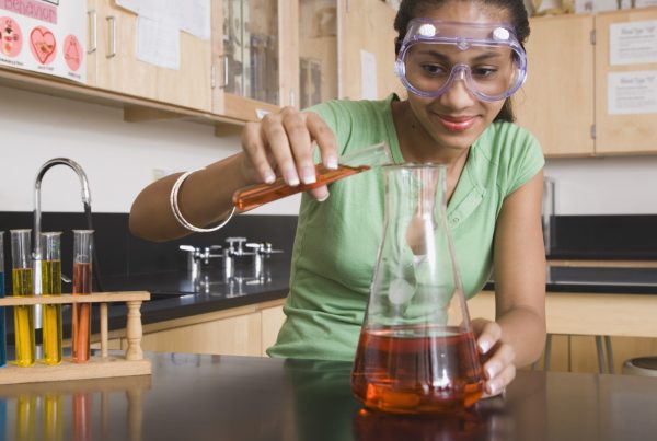 A colour image of Teenage girl performing science as part of the he Smallpeice Trust STEM education Programme supported by The Ellis Campbell Foundation