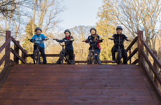 A colour image of a group of children on BMX bikes taking part in theTeen Ranch youth Activity Centre supported by The Ellis Campbell Foundation