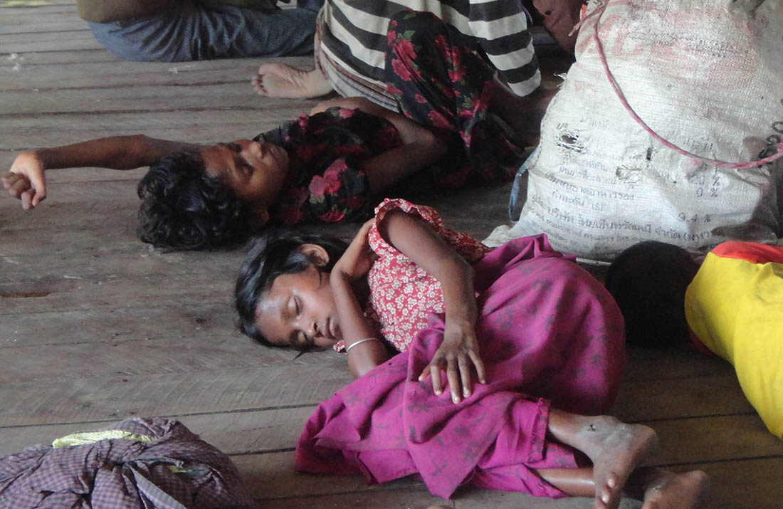 A colour image of children laying on the floor having been displaced from their homes - The Ellis Campbell Foundation supports the DEC Myanmar Appeal