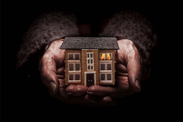 A colour image of hands holding a house used as the advert for Punchdrunk's Small Wonders production supported by The Ellis Campbell Foundation