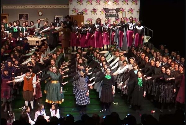 A colour image of lots of children in costume taking part in a Youth on the Move production a charity supported by the Ellis Campbell Foundation