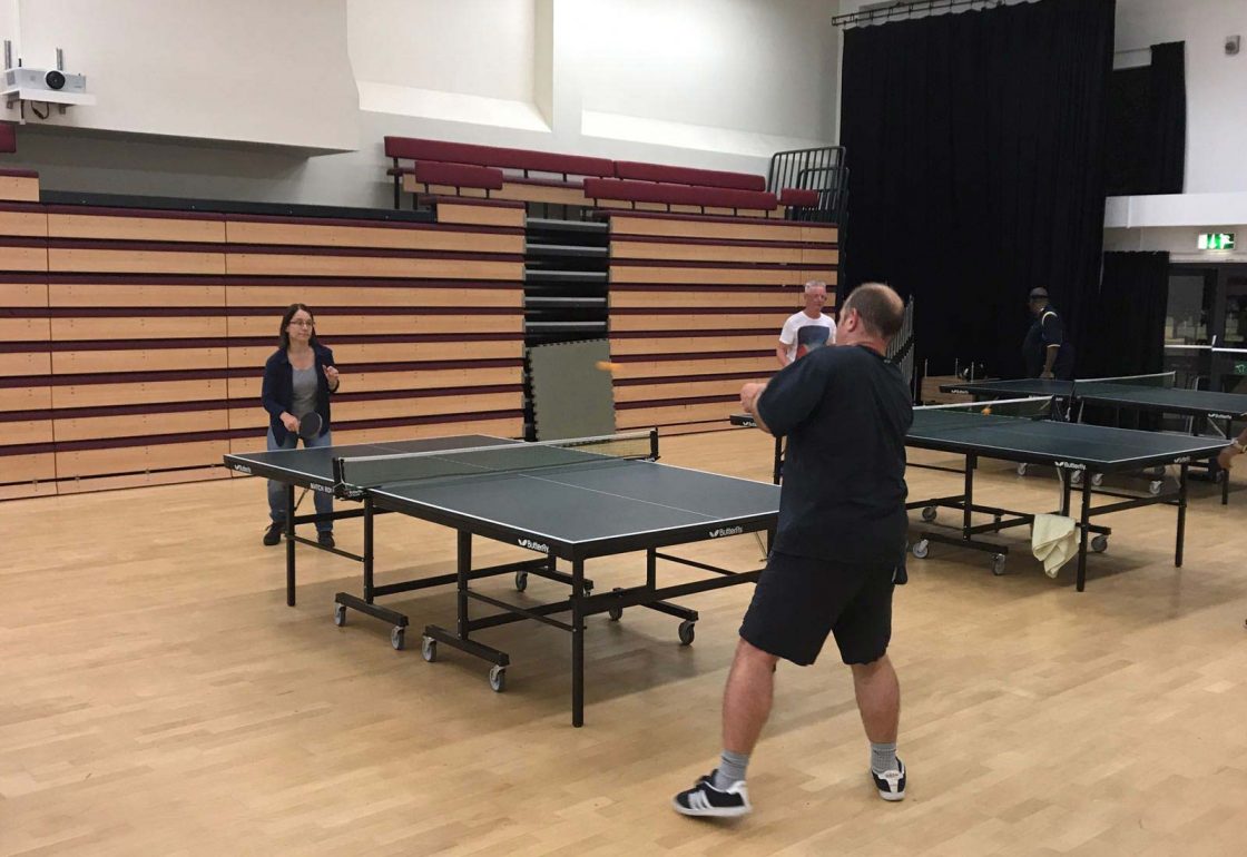 An image of people playing table tennis - Community cohesion by St Katherine's Trust - supported by the Ellis Campbell Foundation