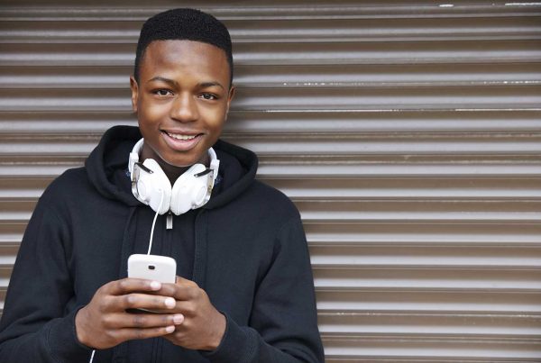 An image of a young smiling black make representing The Brandon Centre supported by The Ellis Campbell Foundation