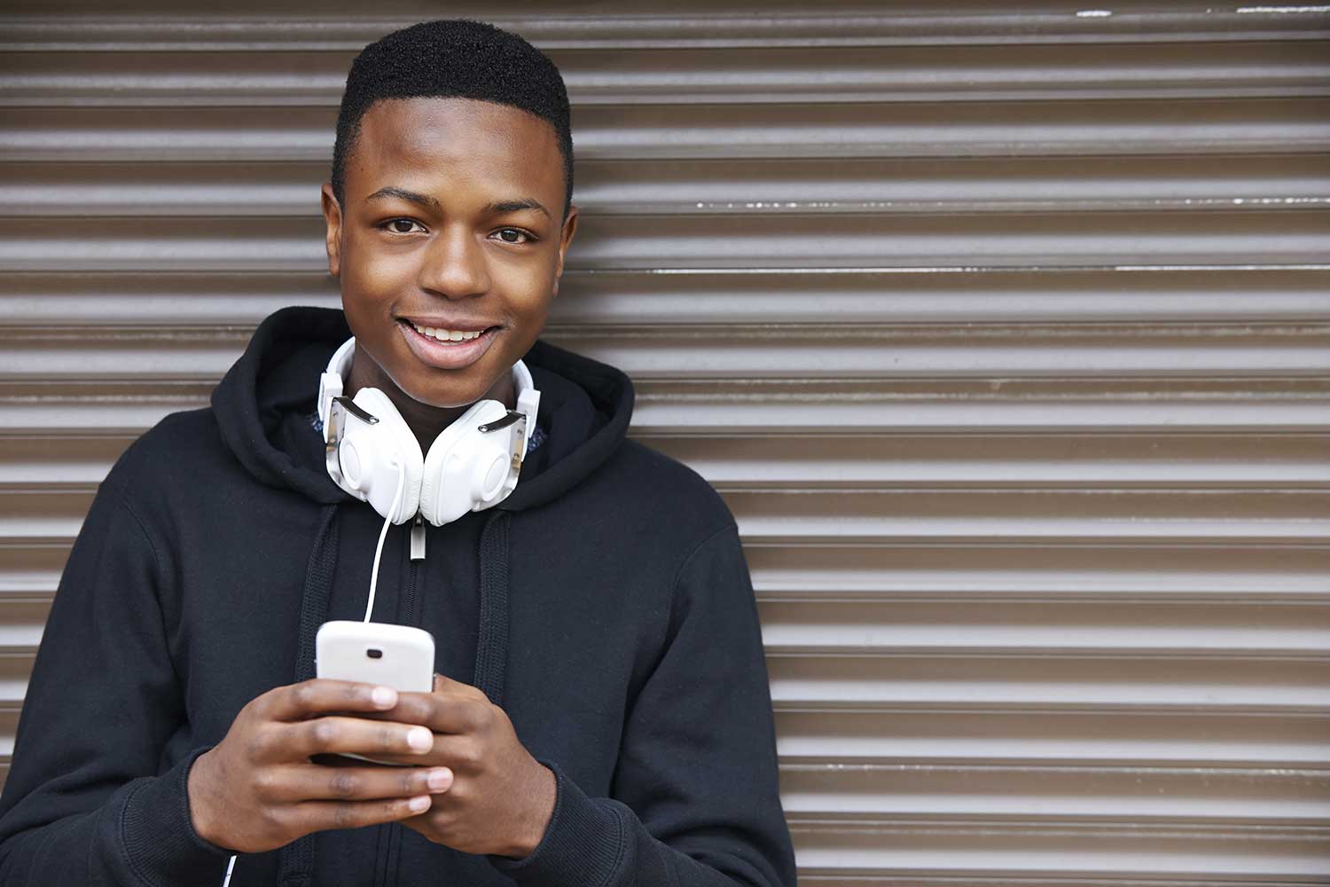 An image of a young smiling black make representing The Brandon Centre supported by The Ellis Campbell Foundation