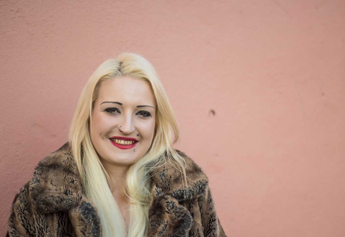 A colour image of a young smiling female - part of the Centrpoint Soho programme supported by The Ellis Campbell Foundation.